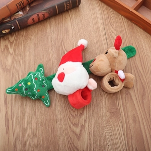 Detailed plush Christmas slap bracelets with Santa, reindeer and tree designs on wood