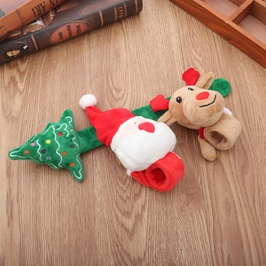 Detailed view of plush Christmas snap bracelets featuring Santa Claus, reindeer and tree