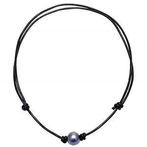 Detailed view of large dark grey pearl fixed with knots on a black leather neck cord