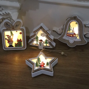 Lighted wooden Christmas tree ornaments featuring stars and bells for holiday decor