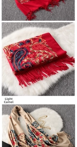 Close-up of ethnic paisley embroidery and tassel trim on warm cashmere-feel pashmina