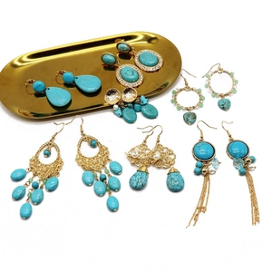 Bohemian turquoise drop earrings set with gold filigree and vintage tassel details