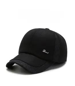 Close-up of black wool baseball cap with grey winter earflaps and Sport embroidery