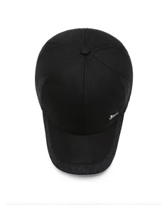 Detail view of winter baseball cap with ear protection and SM metal logo ornament