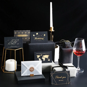 Elegant black and gold birthday greeting card set with gift box and envelopes