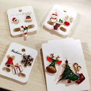 Christmas brooch set featuring cartoon trees and reindeer in festive alloy and enamel