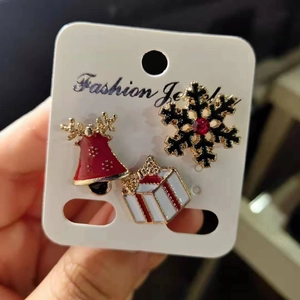 Three-piece Christmas brooch set with gold bell, snowflake and gift box designs