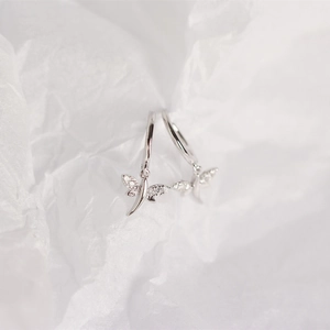 Close-up of S925 sterling silver dragonfly hoop earrings with sparkling crystal accents
