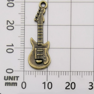 Antique bronze guitar pendant charm 35mm length for jewelry making shown on scale ruler