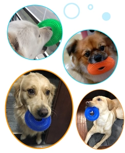 Close-up of durable TPR dog ring toy in green, orange, and blue for large breed teeth cleaning