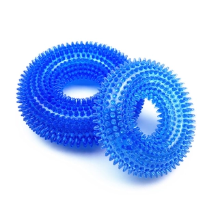Detail of durable blue spiked TPR dog chew rings showing dental cleaning texture