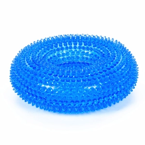 Macro detail of a bright blue spiked TPR dog chew toy showing flexible massage ring texture