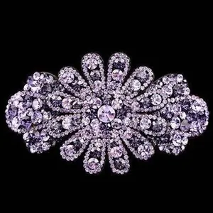Detailed view of floral headband featuring purple and clear rhinestones on silver metal base