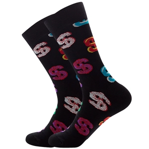 Close-up of black crew socks featuring colorful dollar sign patterns on a white background