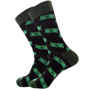 Detail view of cotton crew socks featuring green dollar sign patterns on black fabric