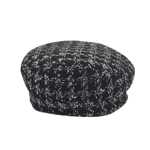 Classic black and white checkered tweed newsboy cap for women in vintage style