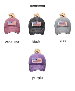 Detail view of washed cotton baseball caps in four colors with ponytail hole and flag patch
