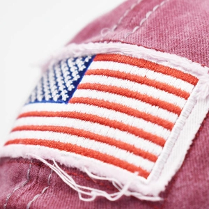 Burgundy washed cotton baseball cap featuring American flag embroidery and distressed brim