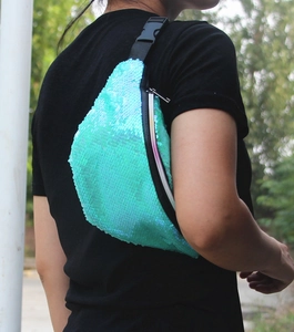 Detail of mint green mermaid sequin waist bag with adjustable black nylon strap and buckle