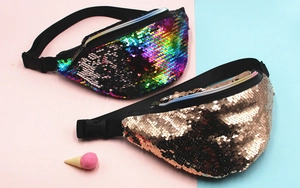 Detail of mermaid sequin fanny packs in rainbow gradient and champagne gold finishes