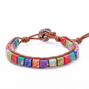 Detailed close-up of handmade bohemian bracelet with colorful square imperial stones