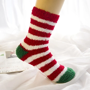 Thick coral fleece Christmas socks featuring festive red and white stripes