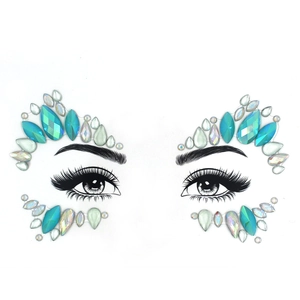 Detailed view of luminous blue and iridescent rhinestone face jewels for eye makeup