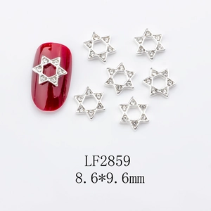 Detailed view of silver alloy star nail charms with clear rhinestones and dimensions