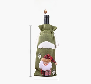Detailed size display of a green burlap Christmas wine bottle cover with Santa claus