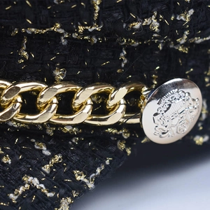 Black tweed newsboy cap with gold threads and chunky metal chain detail