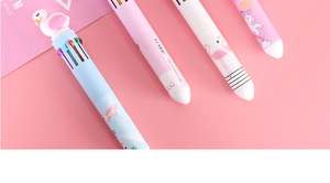 Detail of cute multi-color ballpoint pens with flamingo and unicorn patterns