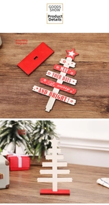 Detailed view of DIY wooden Christmas tree with white festive holiday greetings print