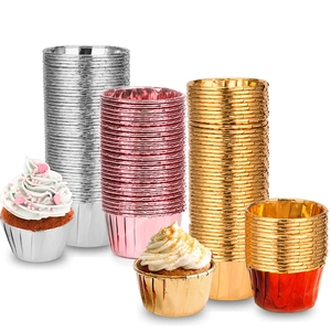 Macro shot of assorted metallic gold and silver foil cupcake liners for festive baking