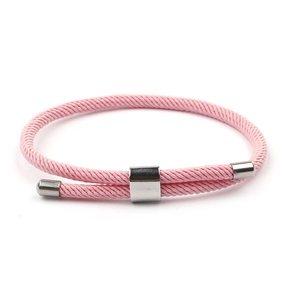 Detailed view of pink woven Milanese cord bracelet with adjustable metal anchor clasp