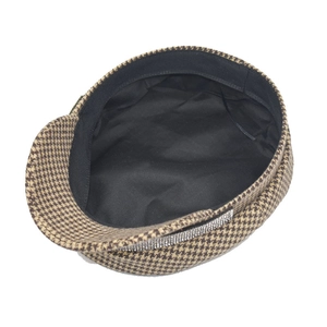 Detailed view of the houndstooth newsboy cap featuring shiny silver rhinestone trim