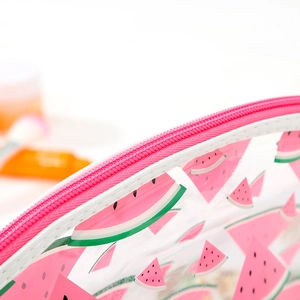 Close-up of transparent PVC makeup bag with pink watermelon pattern and zipper