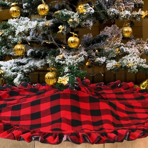 Detail of red and black buffalo plaid Christmas tree skirt with pleated edge decoration
