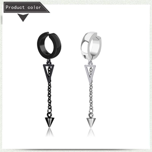 Detail view of black and silver punk triangle earrings with chains and cone charms