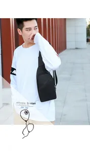 Detailed view of black multi-functional chest bag with adjustable strap on a model