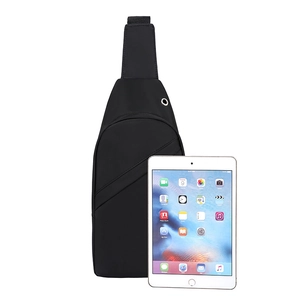 Black nylon multifunctional chest bag with earphone port shown with tablet for scale