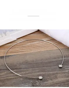 Macro detail of silver stainless steel choker featuring zircon-studded hexagon ends