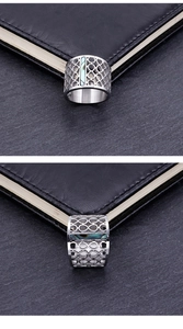 Detail of silver hollowed stainless steel ring with colorful abalone shell inlay