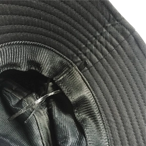 Detail of black sun hat featuring reinforced brim stitching and adjustable inner drawstring