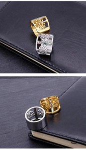 Detailed view of hollow tree of life rings in gold and silver with colorful shell inlays