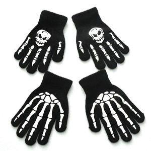 Winter glowing skeleton gloves for kids aged 5-11 featuring luminous skull and bone patterns