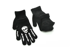 Detail showing knitted gloves for kids with white luminous skull and skeleton bone print