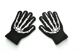 Detailed view of kids knit gloves featuring glow-in-the-dark skull bone patterns