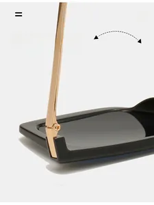 Close-up of durable golden metal hinge on square frame sunglasses for reinforced structure