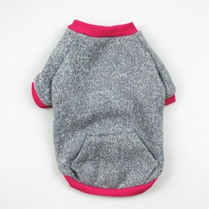 Detail of grey knitted dog sweater with pink ribbed edges and back pocket design