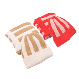 Detail of soft striped knit baby hat and scarf set in beige and red colors
